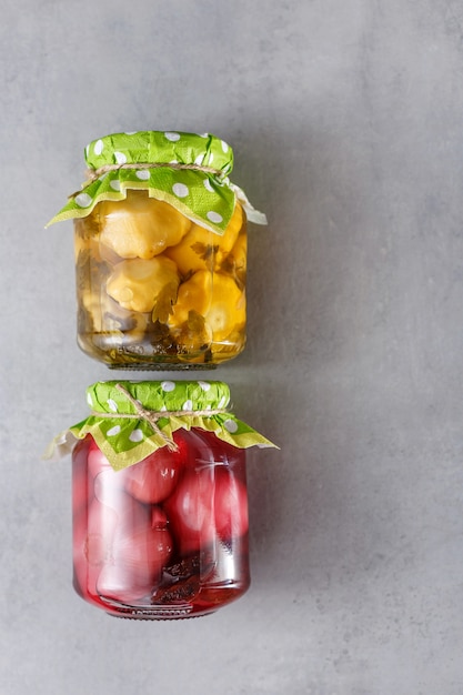 Fermented preserved vegetarian food in glass jars. The concept of canned food.