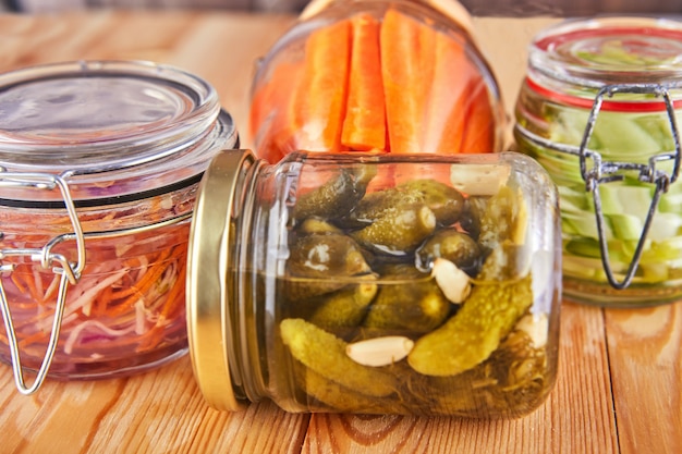 Fermented preserved vegetarian food on wooden table