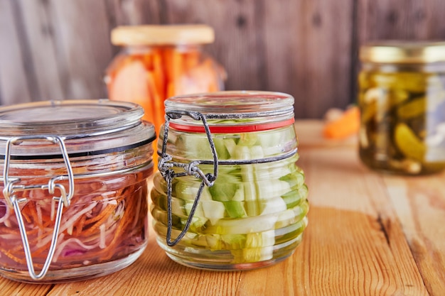 Fermented preserved vegetarian food on wooden table