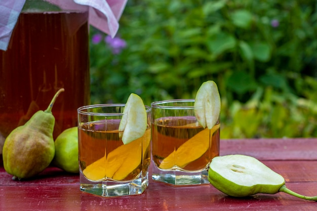 Fermented Raw Kombucha Tea with Pears, Summer Healthy Detox Drink in jar and two glass