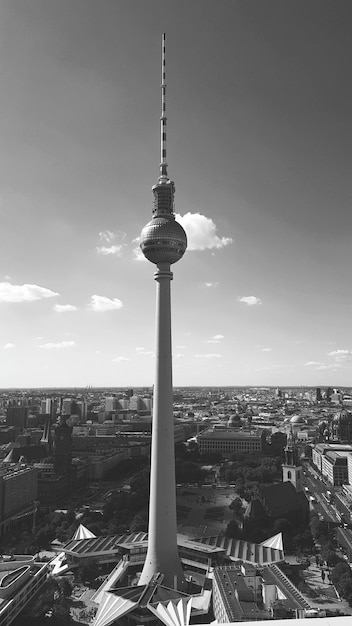 Fernsehturm in city against sky