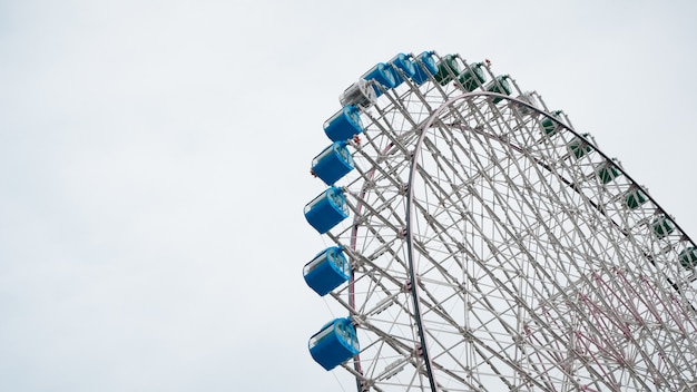 Ferris Wheel Over Blue Sky Background