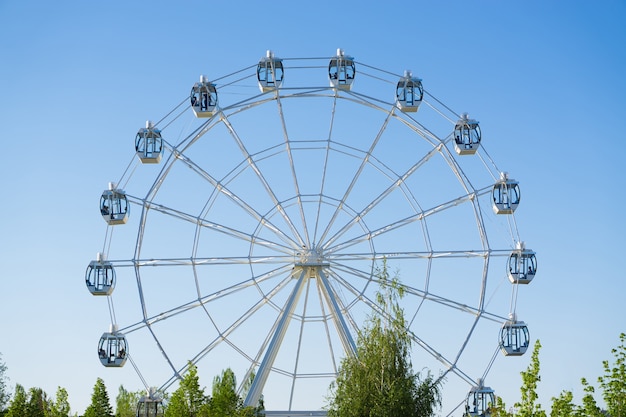 Ferris wheel on blue sky surface