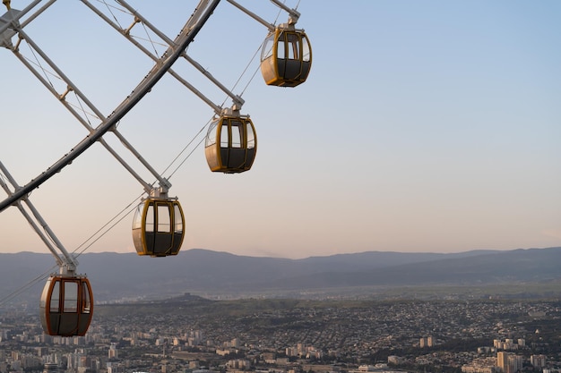 Ferris wheel in mtatsminda amusement park in tbilisi georgia giant wheel at sunset