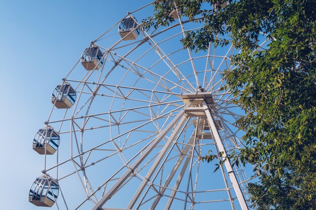 Ferris wheel on the surface of the blue sky