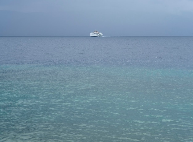 Ferry boat on the horizon in the Aegean Sea in a storm in Greece