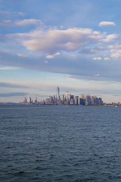 Ferry to Manhattan. View of Manhattan from the water at sunset, New York, USA