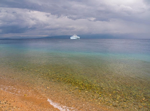 Ferryboat on island Evia (Euboea), Greece on a cloudy day in Aegean Sea