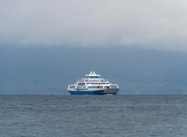 Ferryboat on island Evia (Euboea), Greece on a cloudy day in Aegean Sea