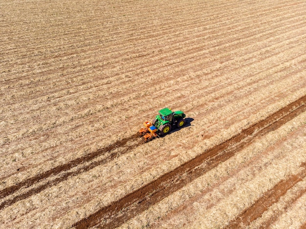 Fertilizing land where sugar cane was planted aerial view.