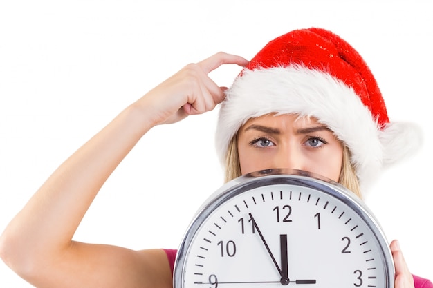 Festive blonde showing a clock