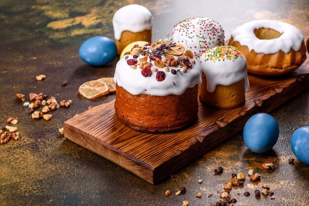 Festive cakes with white glaze, nuts and raisins