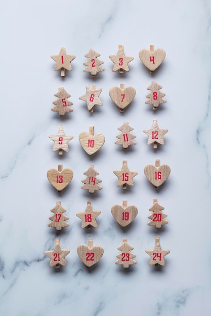 Festive Christmas advent calendar made from wooden shapes