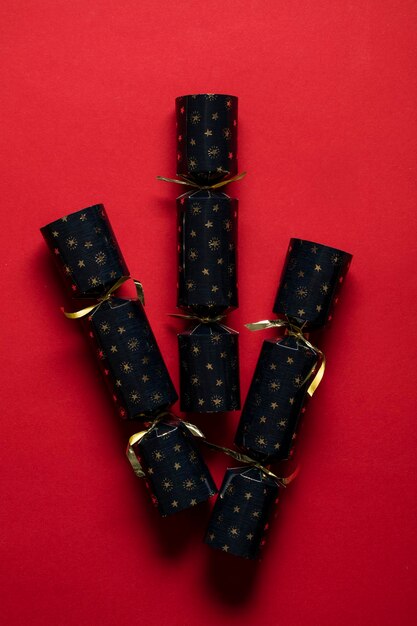 Festive Christmas crackers on a bright red background