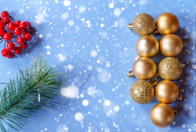 Festive Christmas ornaments and decorations on blue paper background