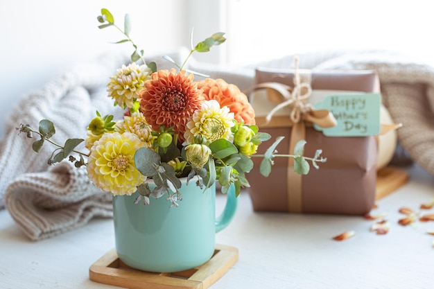 Festive composition for mothers day with gift box and flowers