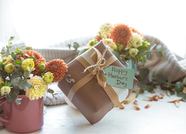 Festive composition for mothers day with gift box and flowers