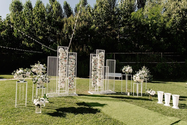 The festive decor of the wedding arch is a flower arrangement The area of ​​the wedding ceremony