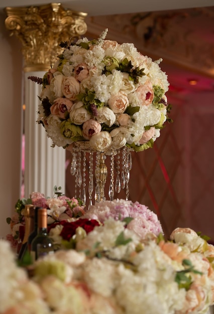 Festive decoration of the banquet with flowers Bouquets of roses in delicate colors