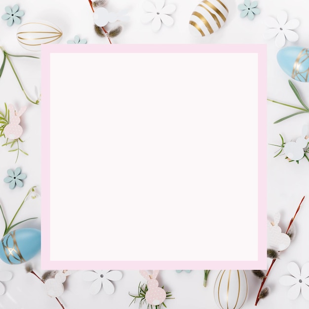 Festive Easter border frame from easter eggs and spring flower crocus on blue background