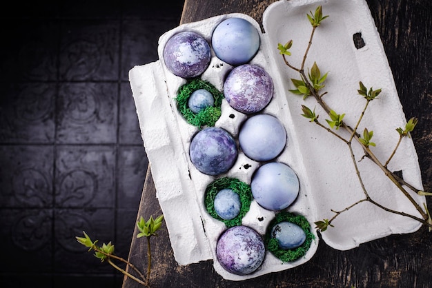 Festive easter eggs in purple and blue color