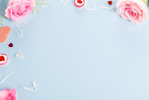 Festive flower composition on blue background Overhead view