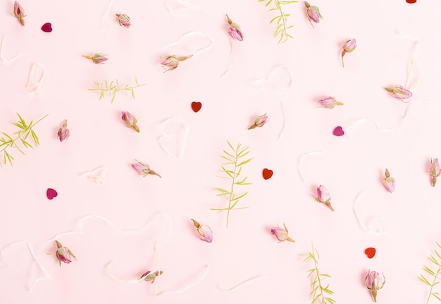 Festive flower composition on pink background Overhead view