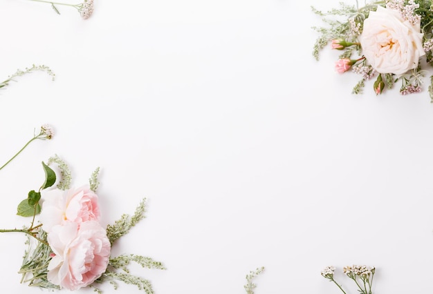 Festive flower composition on the white background Overhead view