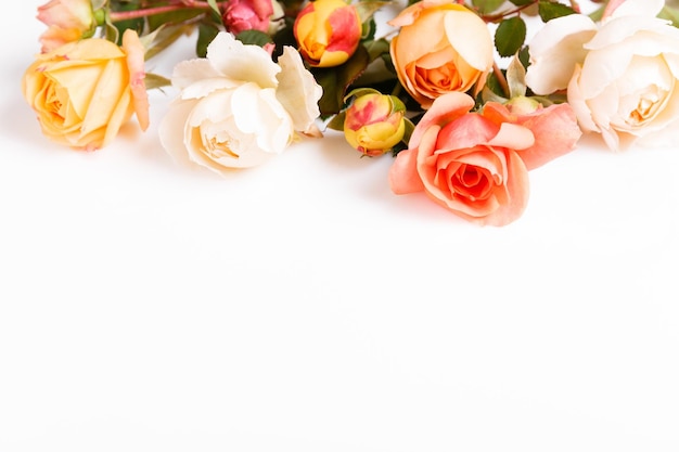 Festive flower composition on the white wooden background overhead view