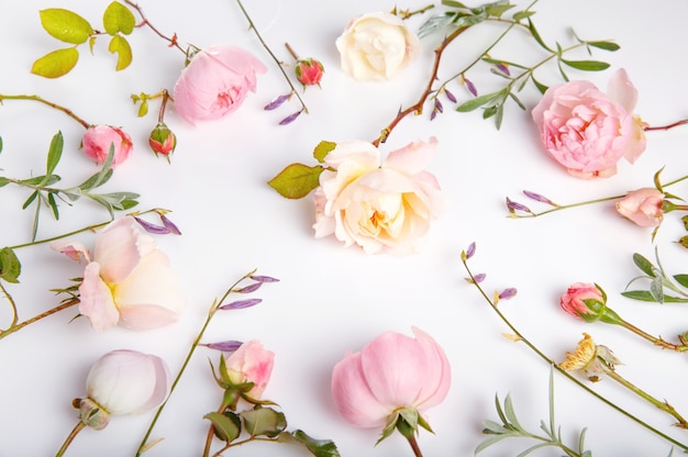 Festive flower English rose composition on the white background. Overhead top view, flat lay. Copy space. Birthday, Mother's, Valentines, Women's, Wedding Day concept.