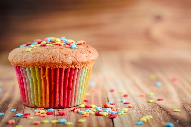 Festive fruitcake on wooden background