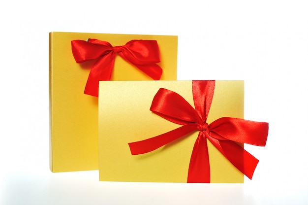 Festive gold box with a red bow 