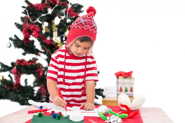 Festive little boy drawing pictures