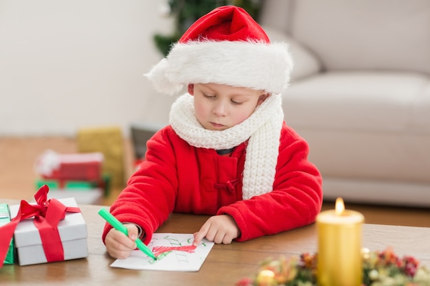 Festive little boy drawing pictures