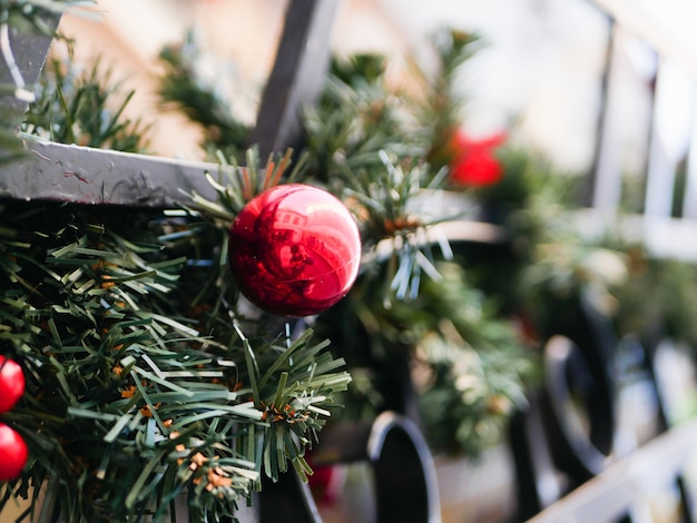 Festive new year red balls hanging on the street. High quality photo