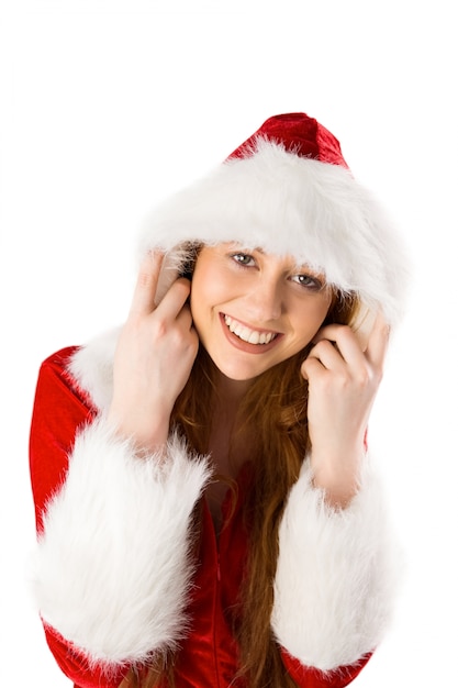 Festive redhead smiling at camera