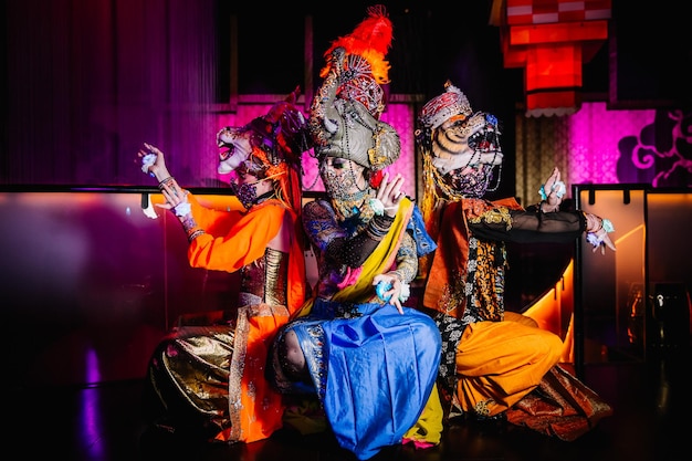 Festive smiling can can dancer in blue costume is showing her performance Artists of the dance masquerade show