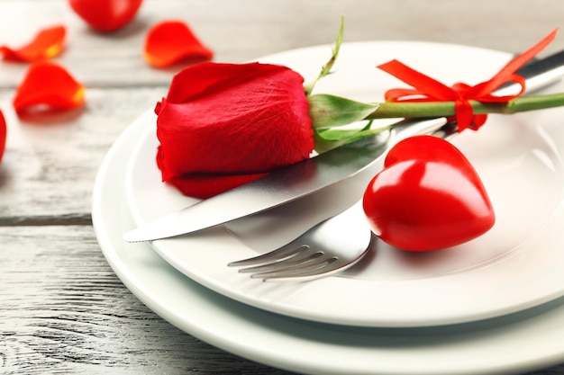 Festive table setting for Valentines Day on wooden background