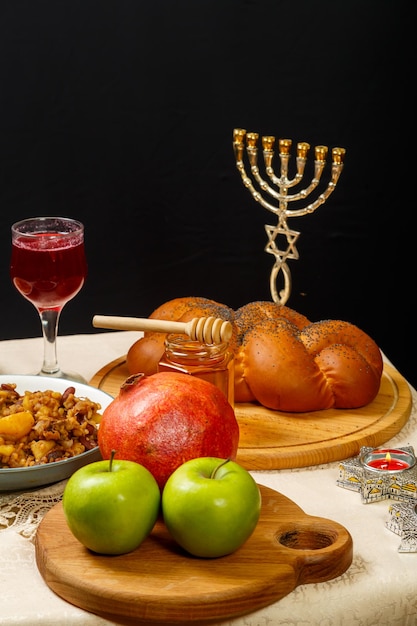 Festive table with ritual traditional dishes for Rosh Hashanah