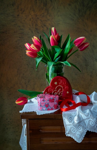 Festive tulips on wooden background