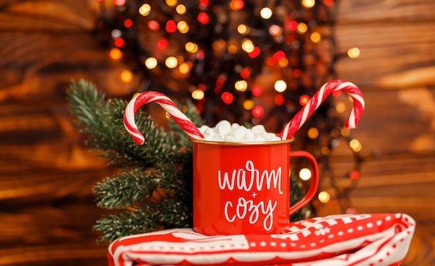 Festive xmas mug with a cookie holiday concepts festive bokeh