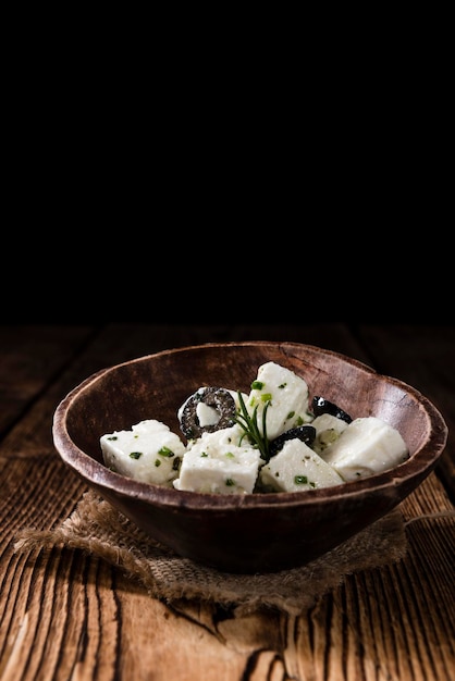 Feta Cheese Marinated on wooden backround