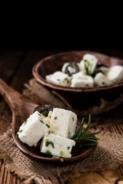 Feta Cheese Marinated on wooden backround