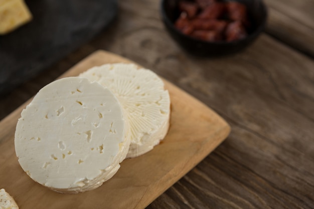 Feta cheese on wooden board