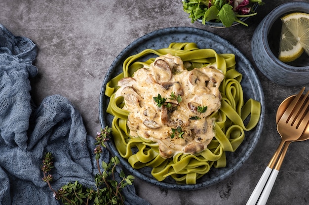 Fettuccine pasta with cream sauce with mushrooms