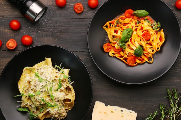 Fettuccine pasta with tomatoes and herbs, sauce and basil