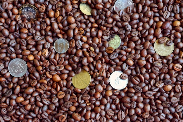 A few coins on coffee beans