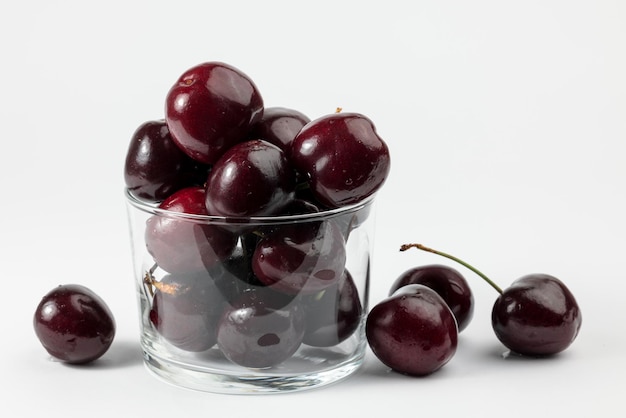 A few delicious cherries on white background.