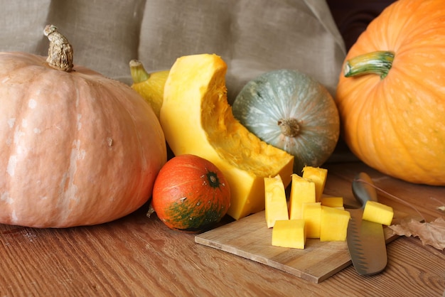 Few pumpkin cutting harvest on wooden table