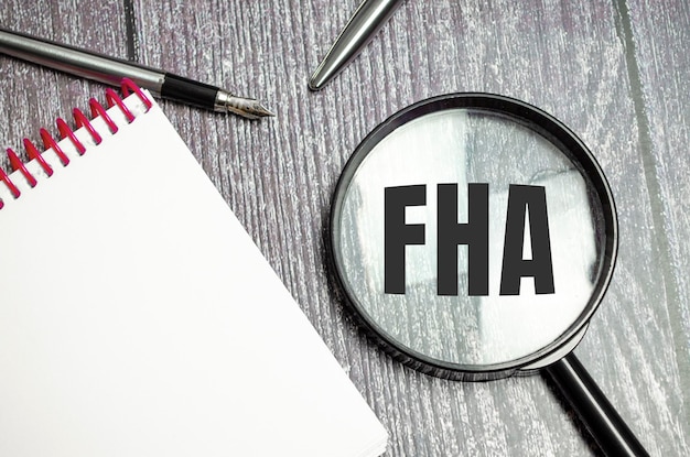 FHA loan on a table with pen and magnifier